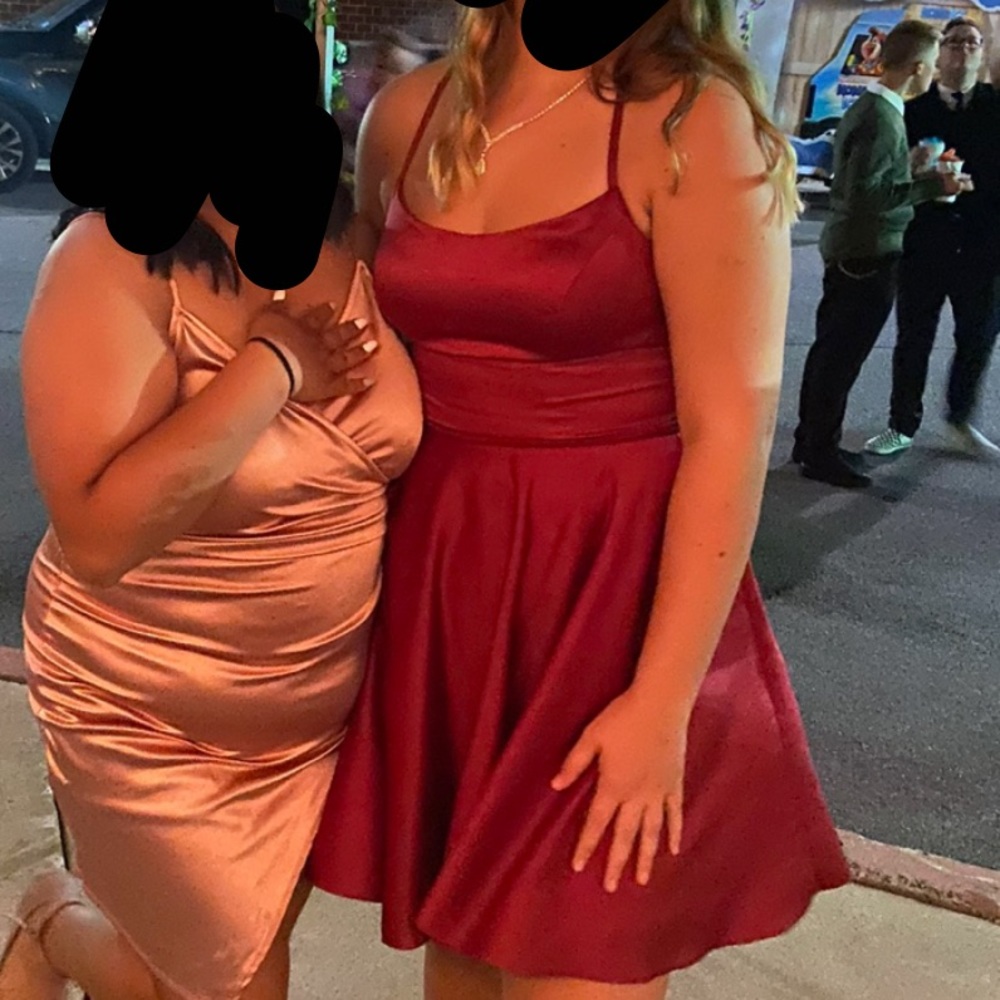 This dress is from Dave and Johnny. It’s a size 9/10 and it’s red/Burgundy